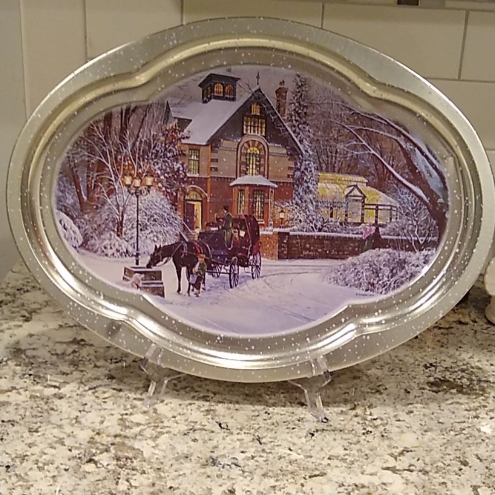 A decorative tin Christmas platter